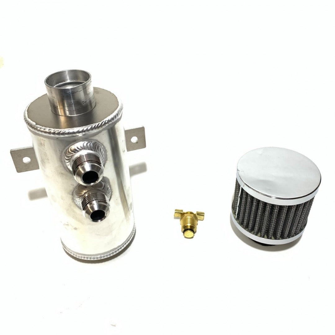 West Bend Dyno Universal Catch Can Kit installed in an engine bay, showing top-mounted breather filter and dual -10 AN ports.