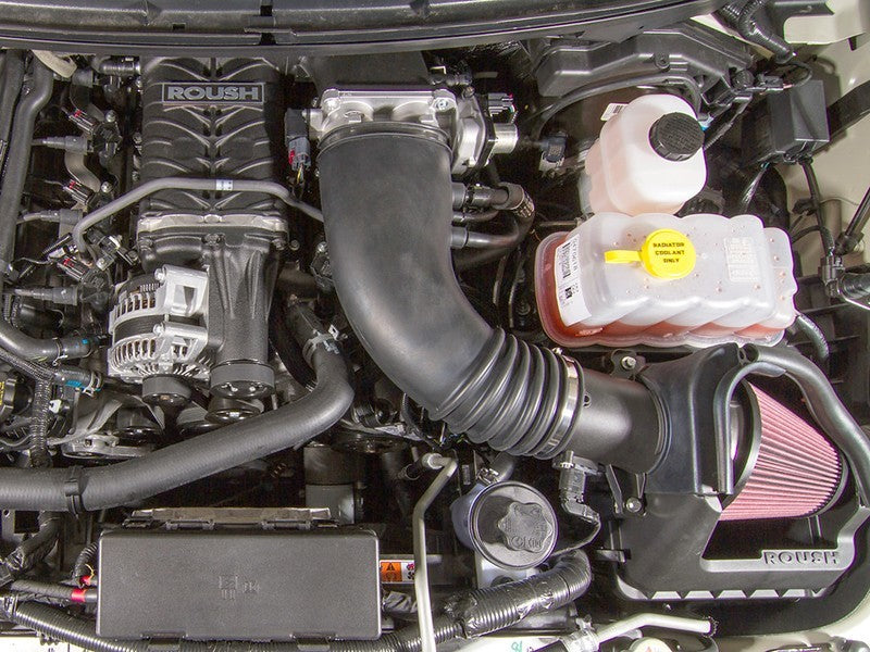 ROUSH 2011-2014 Ford F-150 6.2L V8 590HP Phase 2 Calibrated Supercharger Kit installed under hood of an F-150.