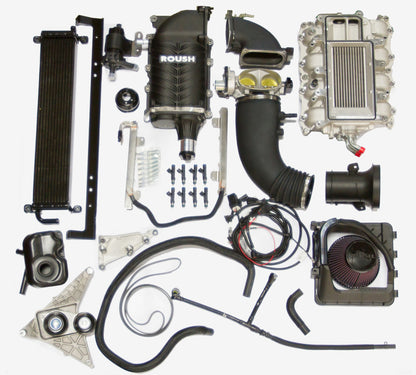 ROUSH 2011-2014 Ford F-150 5.0L V8 570HP Phase 2 Calibrated Supercharger Kit installed under the hood of a Ford F-150.