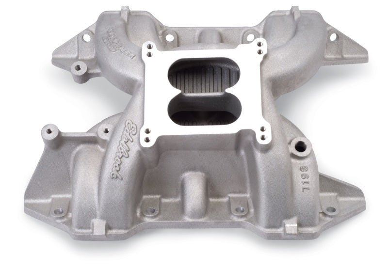 Edelbrock Perf RPM 440 Polished Manifold installed on a classic Chrysler 440 V8 engine bay with polished aluminum finish.