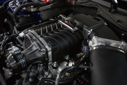 ROUSH 2015-2017 Ford Mustang 5.0L V8 600HP Phase 2 Calibrated Supercharger Kit installed under the hood of a 2016 Mustang GT.