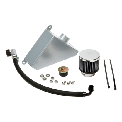 Universal West Bend Dyno Oil Catch Can installed in a 2010–2015 Camaro engine bay with top-mounted breather filter visible.