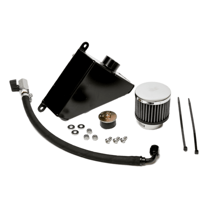Universal West Bend Dyno Oil Catch Can installed in a 2010–2015 Camaro engine bay with top-mounted breather filter visible.